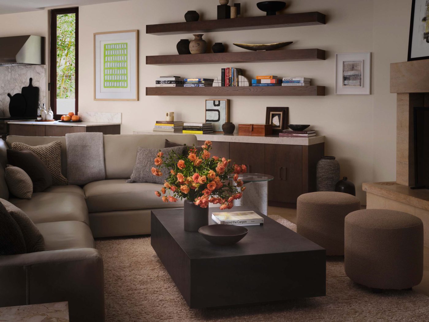 Family room with a green Lori Brunner painting and floating shelves, photographed by Douglas Friedman