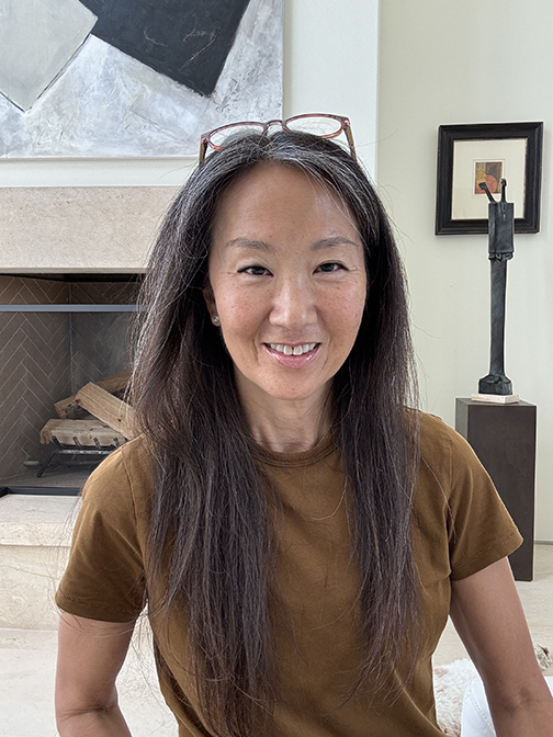 Lori Brunner smiling in her La Jolla living room
